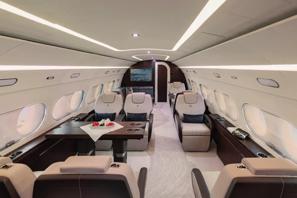 ACJ TwoTwenty 9H-220CJ executive area with club seating and table