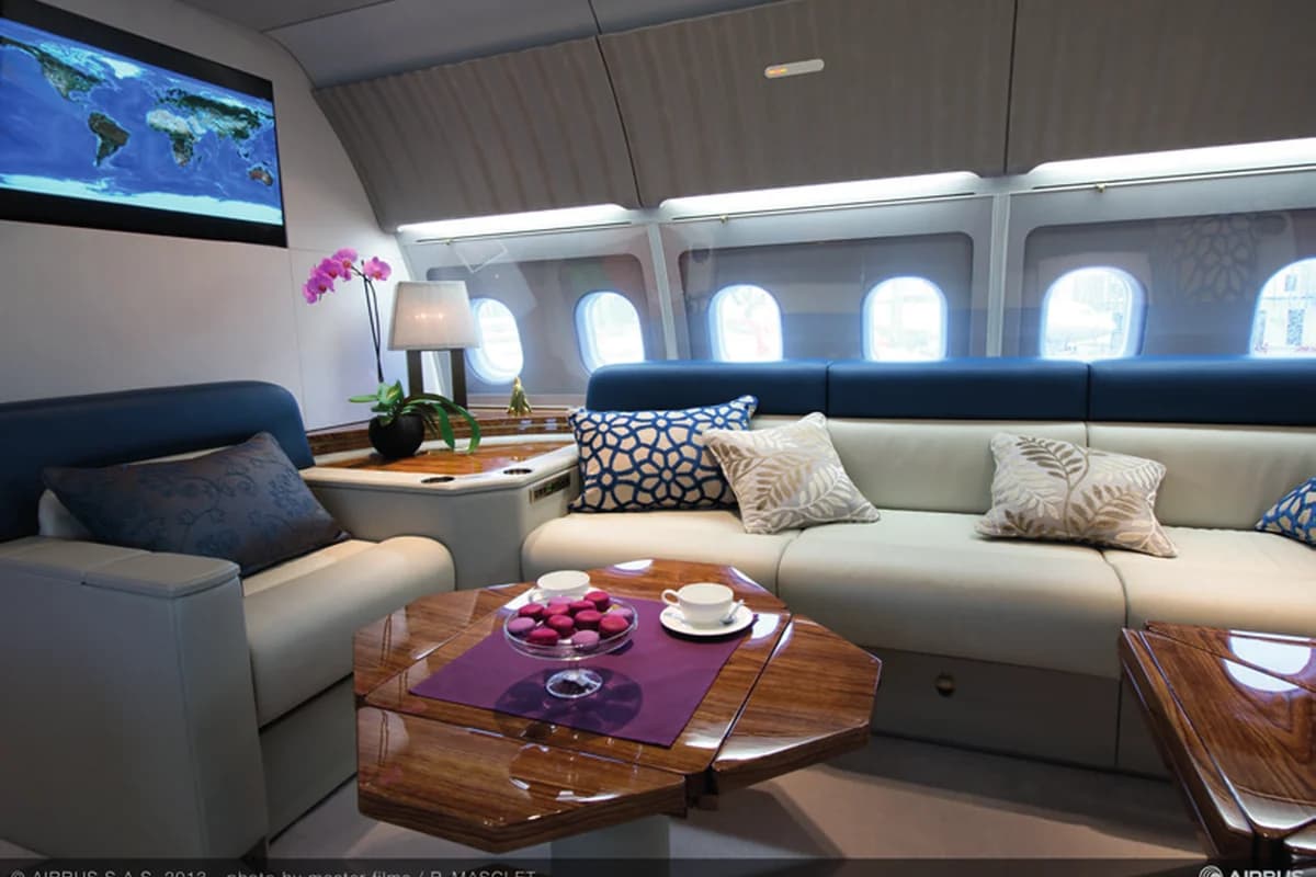 ACJ318 9H-BDONE lounge seating with cushions and wall screen