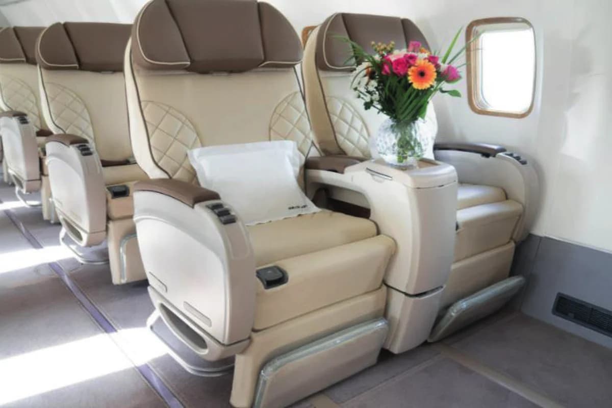 737-500 BBJ 9H-MAC seat pair with table and flowers