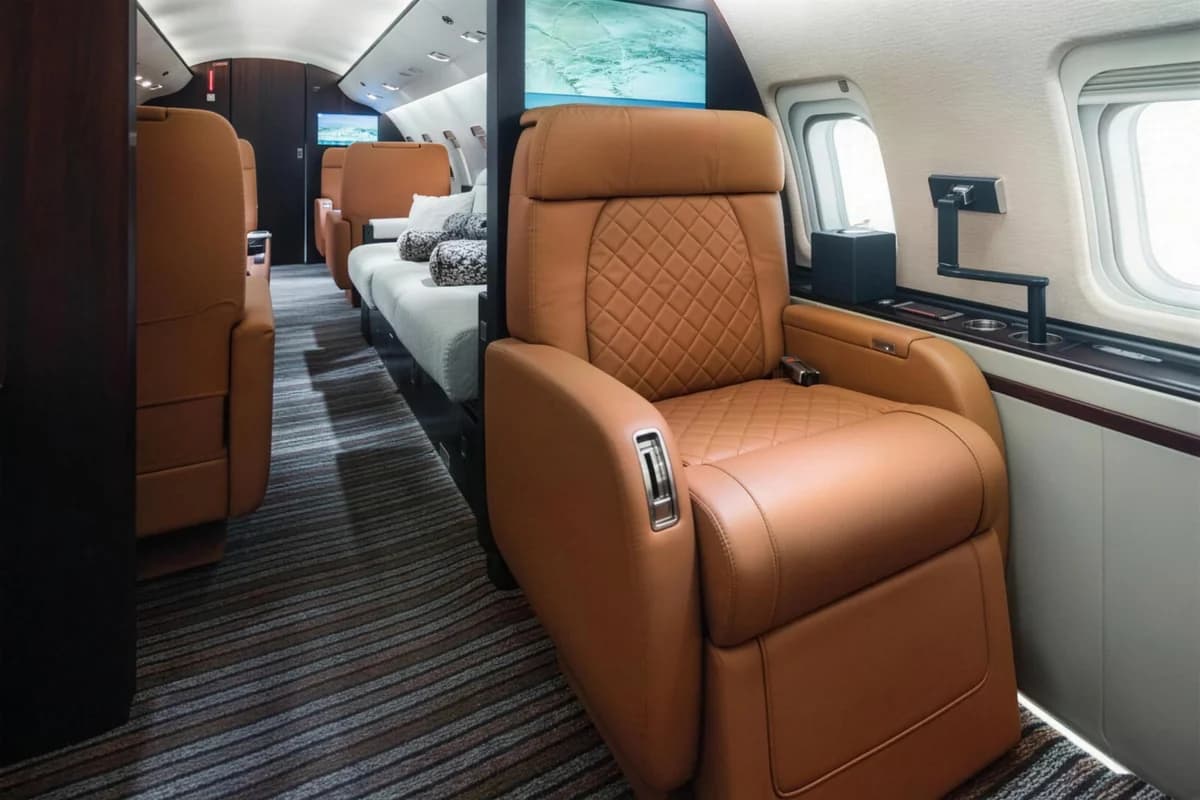 Challenger 850 UP-C8505 tan leather seat by the window